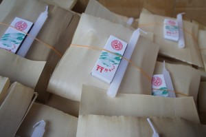 a bamboo-sheath-like package of offerings